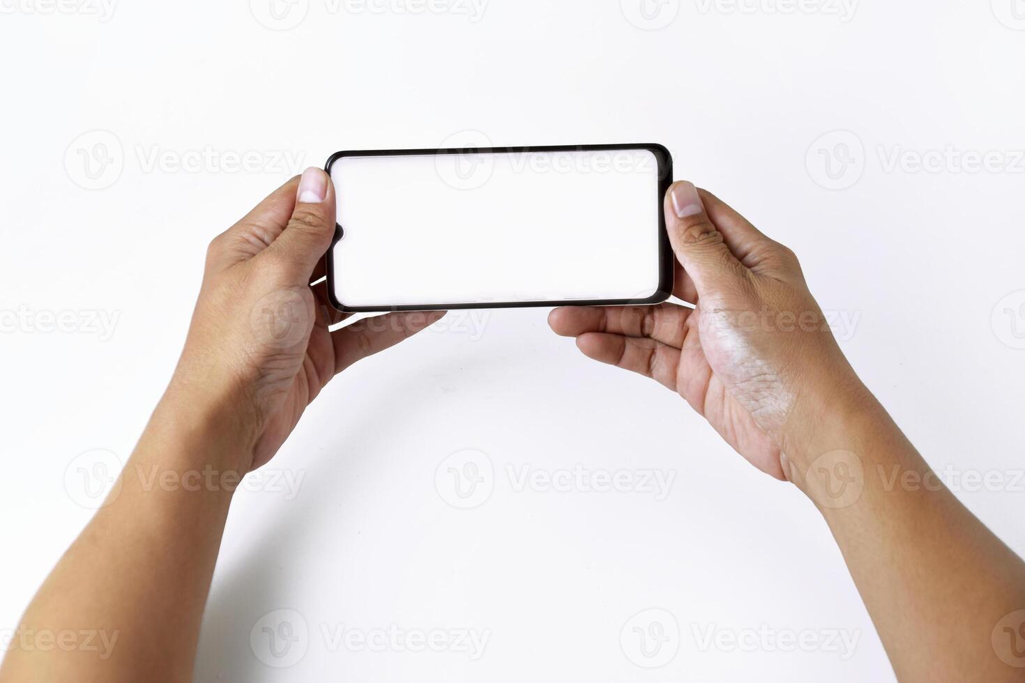 Male hand shows the screen of a mobile smartphone which has a white screen photo