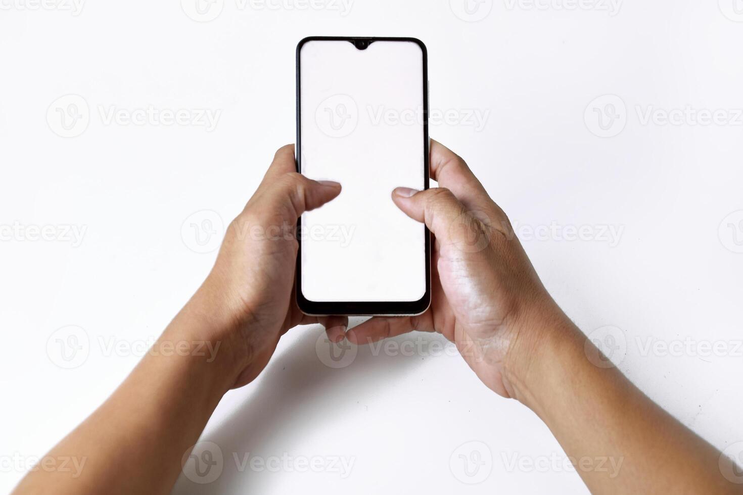 Someones hand is pressing and pointing at the screen of a smartphone photo