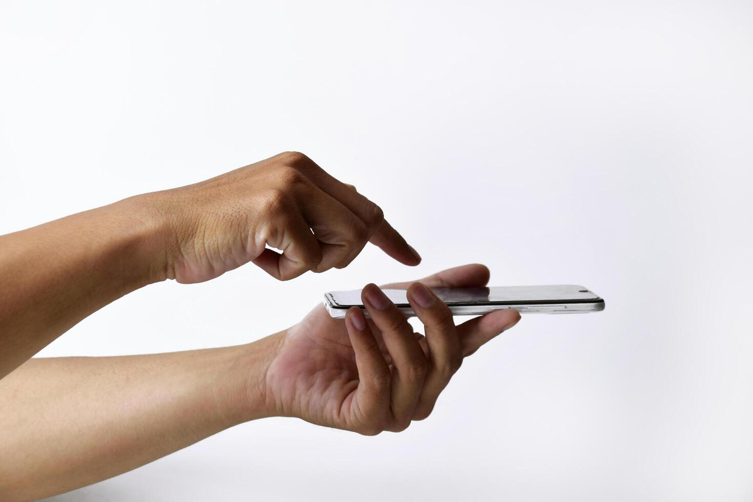 Someone's hand is pressing and pointing at the screen of a smartphone photo