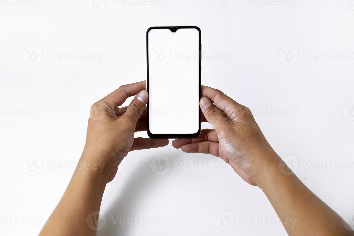 Male hand shows the screen of a mobile smartphone which has a white screen photo