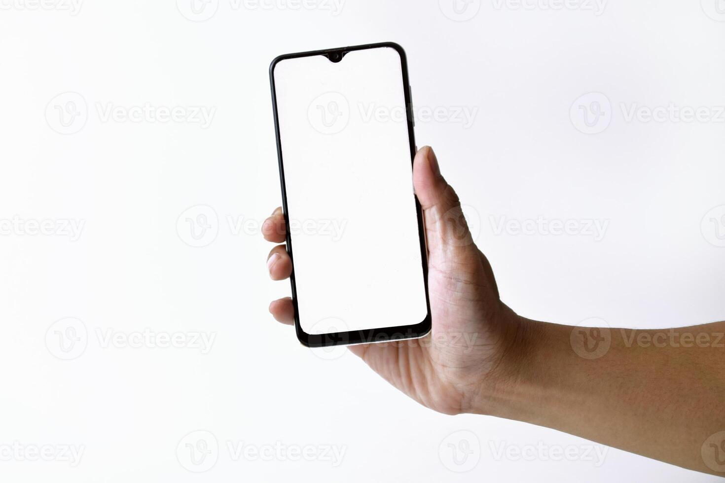 Male hand shows the screen of a mobile smartphone which has a white screen photo