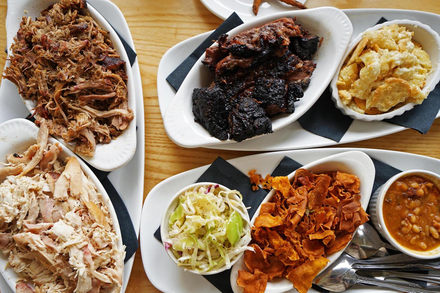 Close up barbecue pulled pork and chicken served with cheesy Macaroni and sweet potato salad photo