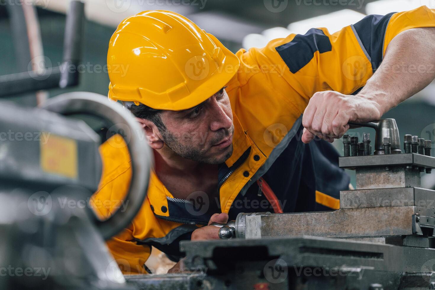 Caucasian engineer using a laptop in a factory. man working in plastics factory. photo