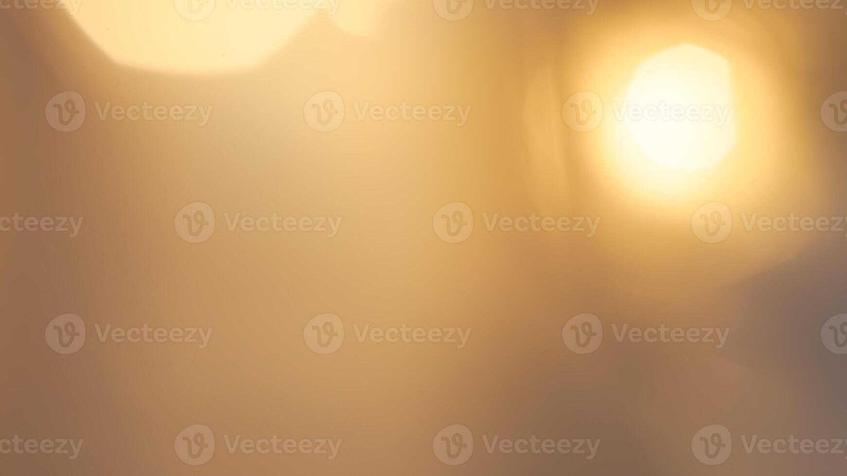 Warm glowing bokeh lights in a golden festive background for holiday celebrations photo
