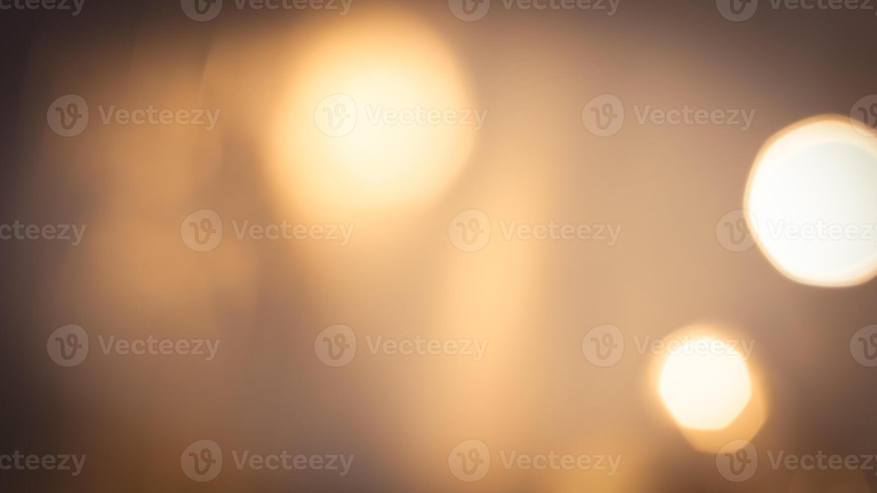 Warm glowing bokeh lights in a golden festive background for holiday celebrations photo