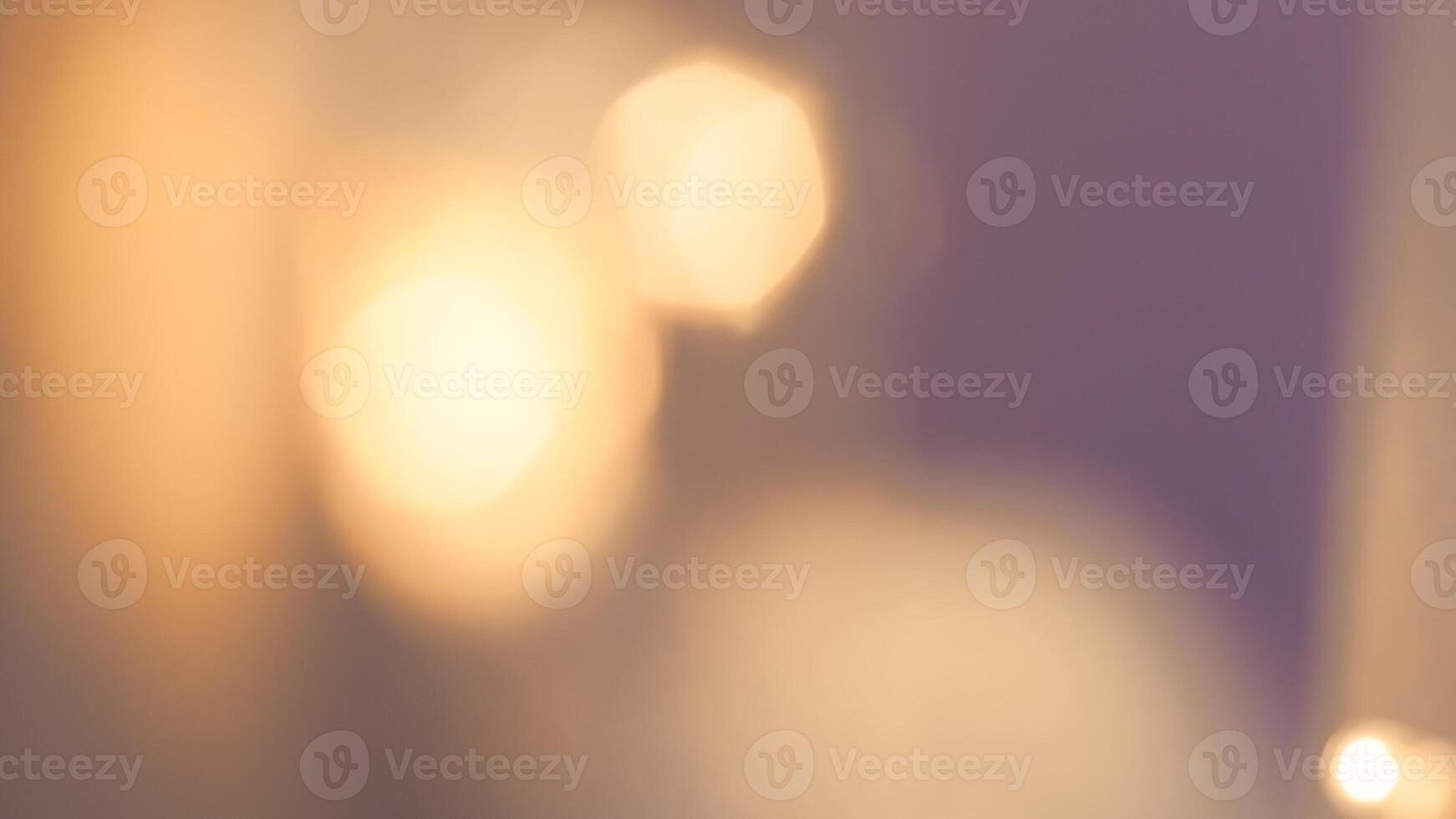 Golden bokeh festive background with soft, twinkling lights and a glowing effect photo