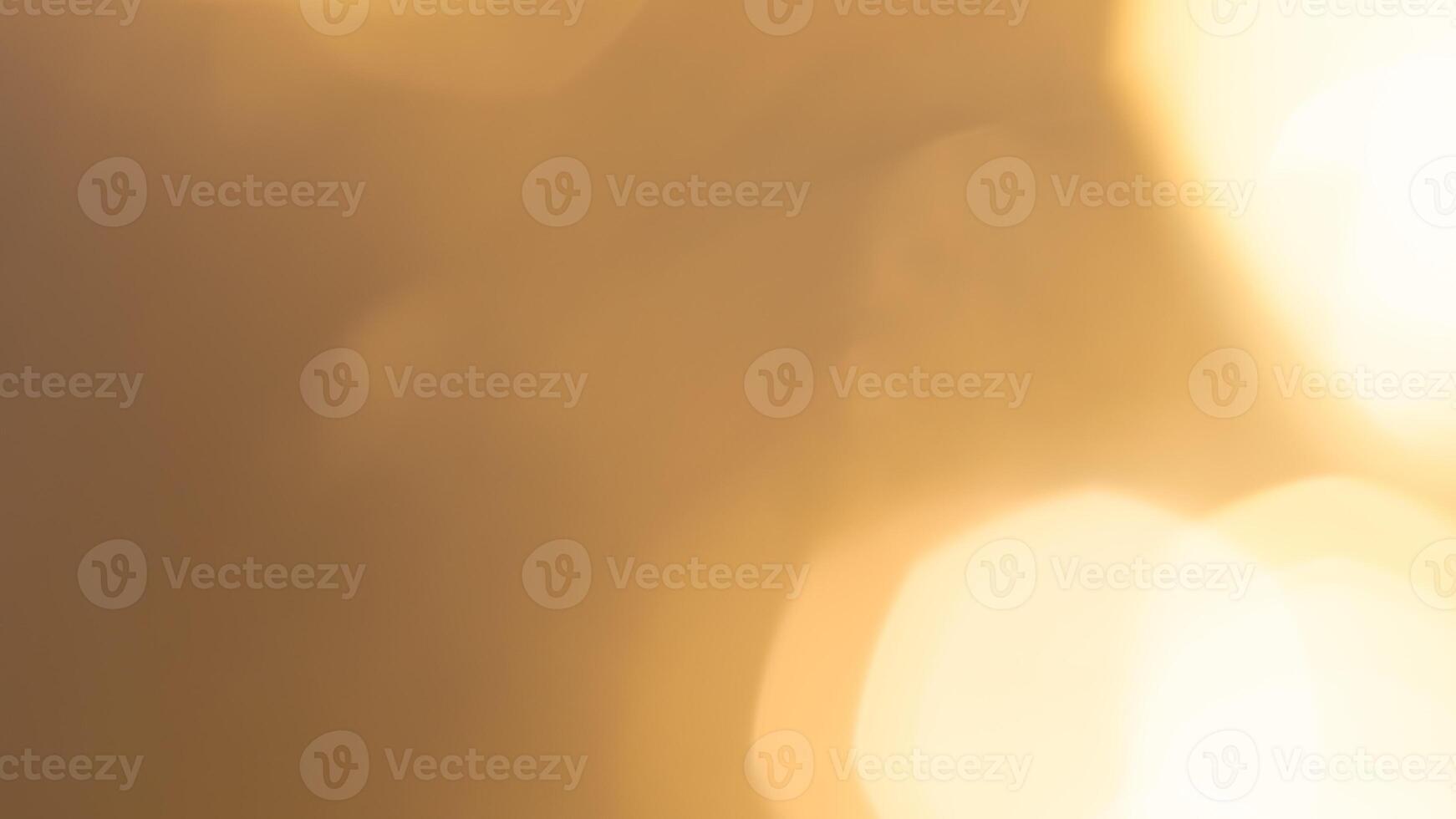 Shimmering golden bokeh lights in a vibrant holiday background with a radiant glow photo