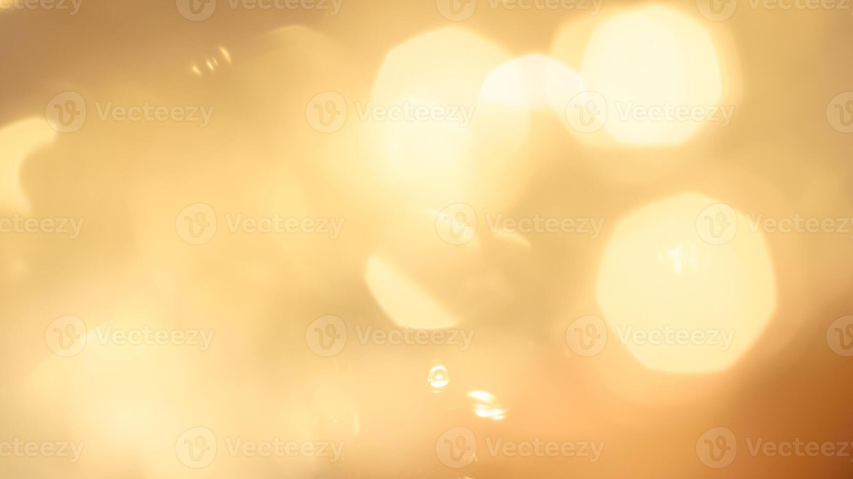 Vibrant festive golden bokeh with sparkling lights and a warm holiday glow photo