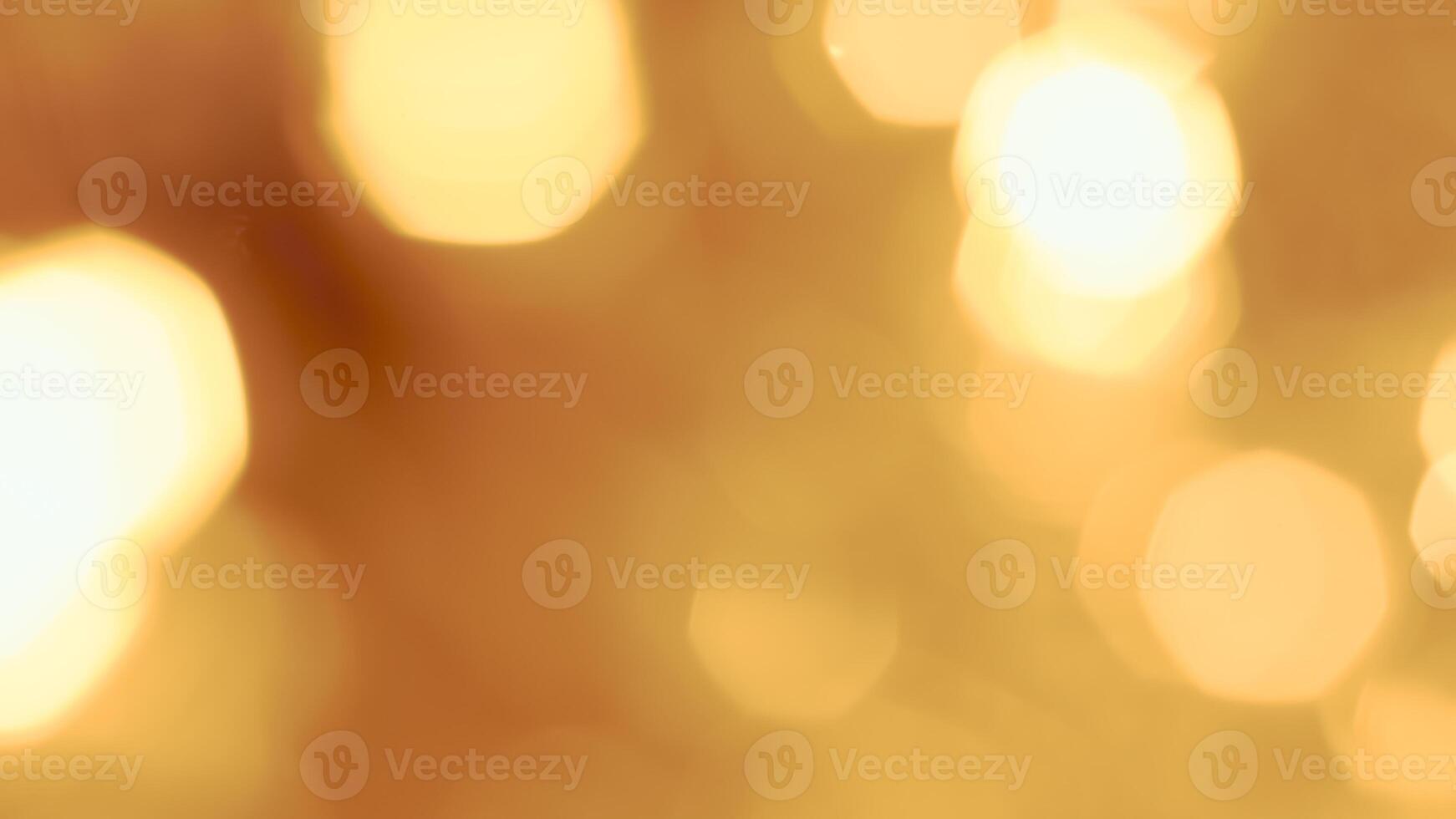 Golden bokeh lights with a soft and elegant glow, perfect for holiday celebrations photo