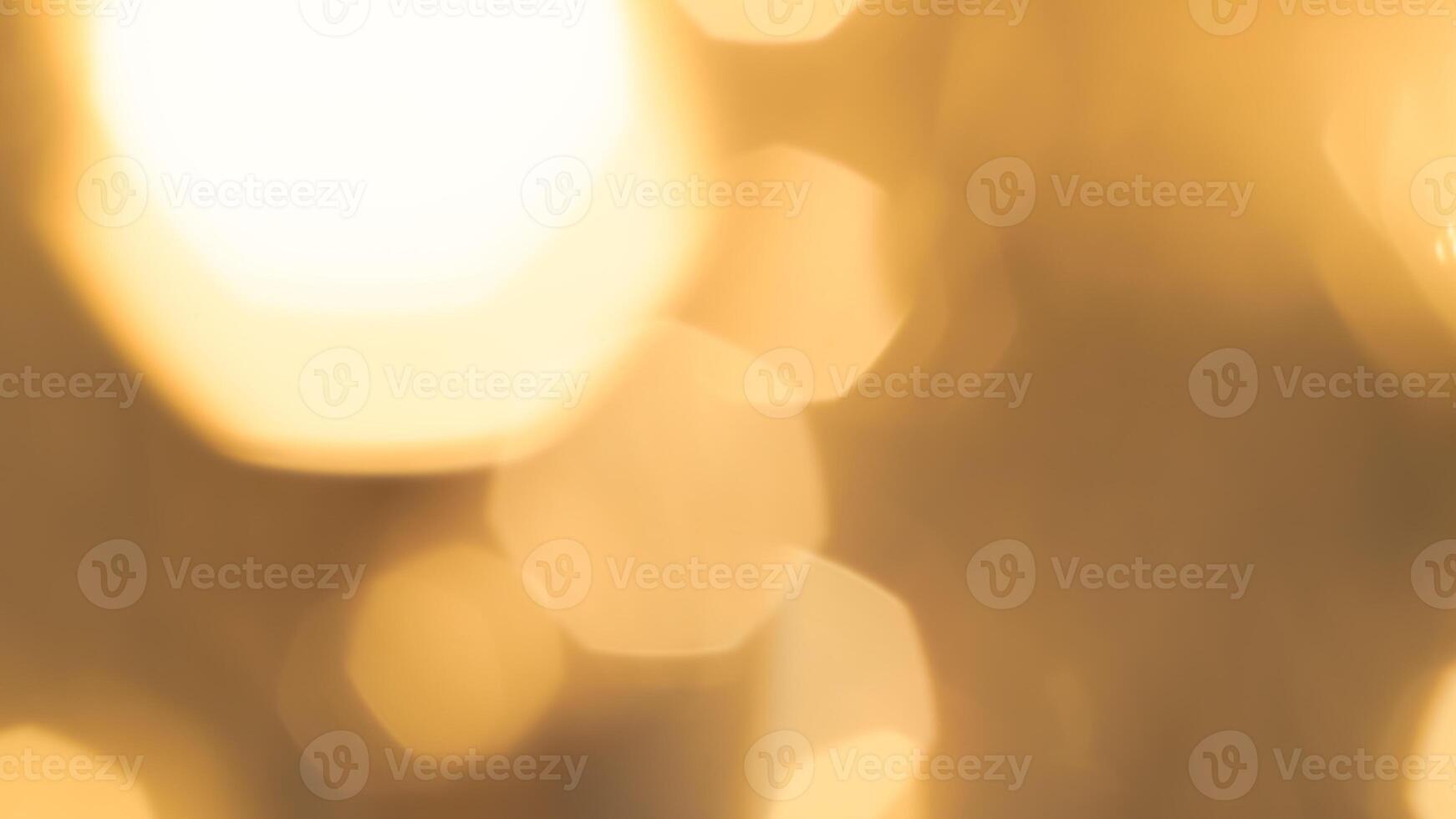 Golden bokeh festive lights with a soft, warm glow creating a cheerful atmosphere photo