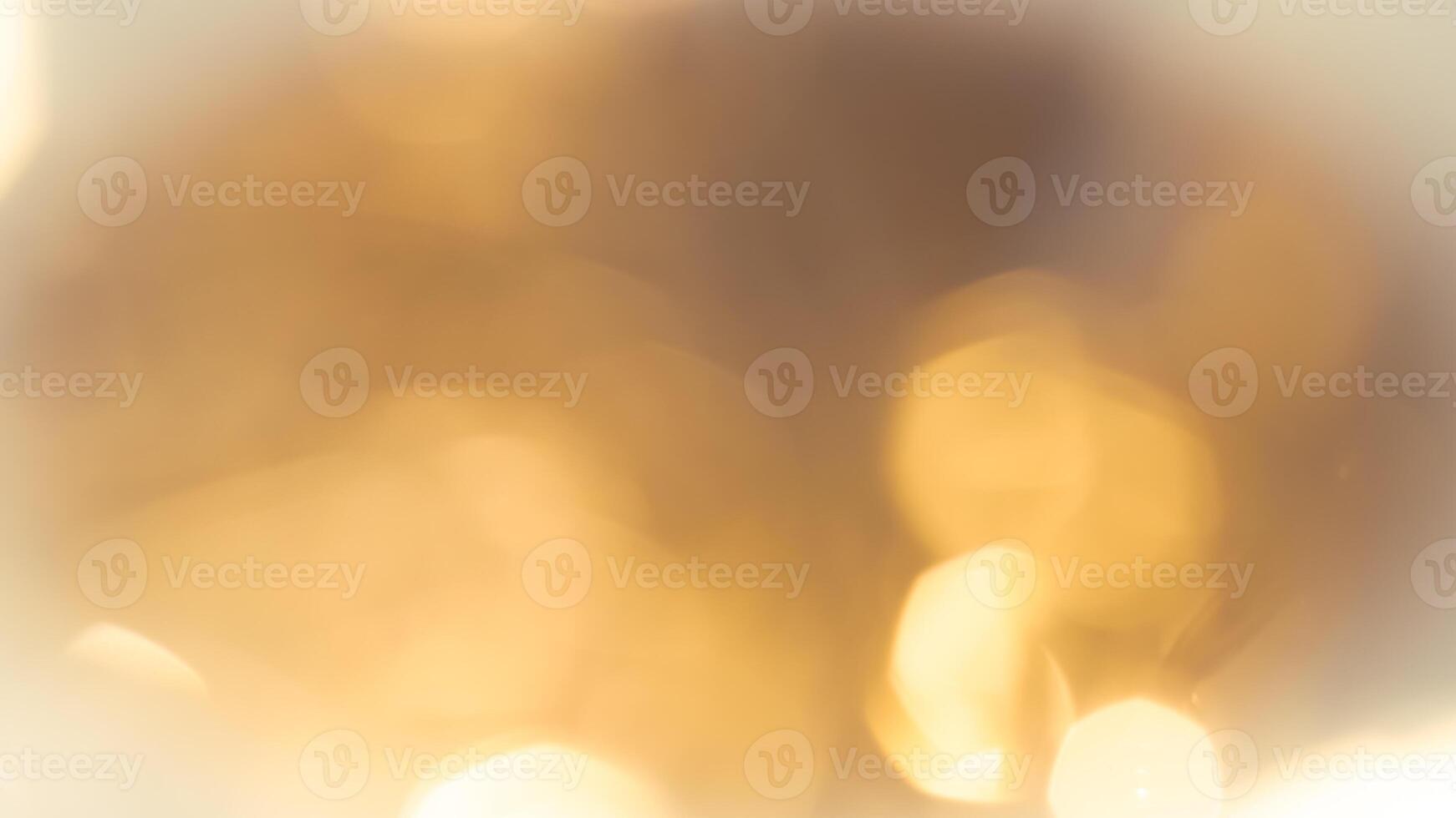 Warm glowing bokeh lights in a golden festive background for holiday celebrations photo
