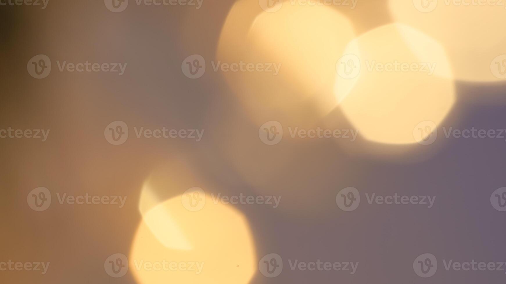 Golden bokeh festive background with soft, twinkling lights and a glowing effect photo