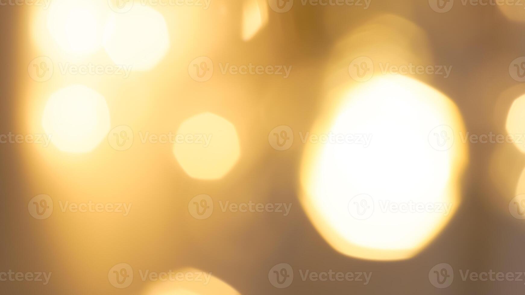 Golden bokeh festive lights with a soft, warm glow creating a cheerful atmosphere photo