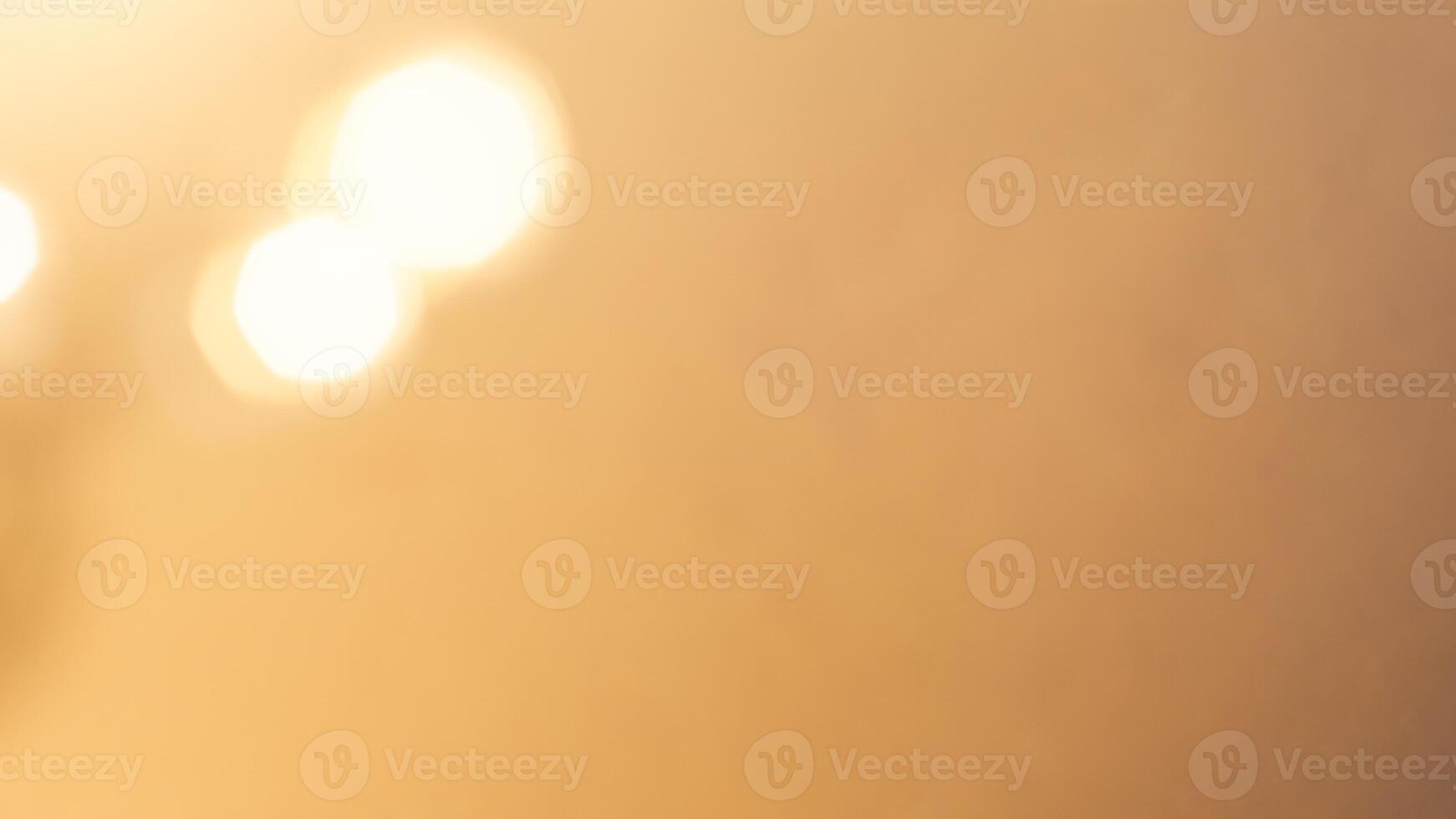 Soft golden bokeh background with a subtle glowing and elegant festive ambiance photo