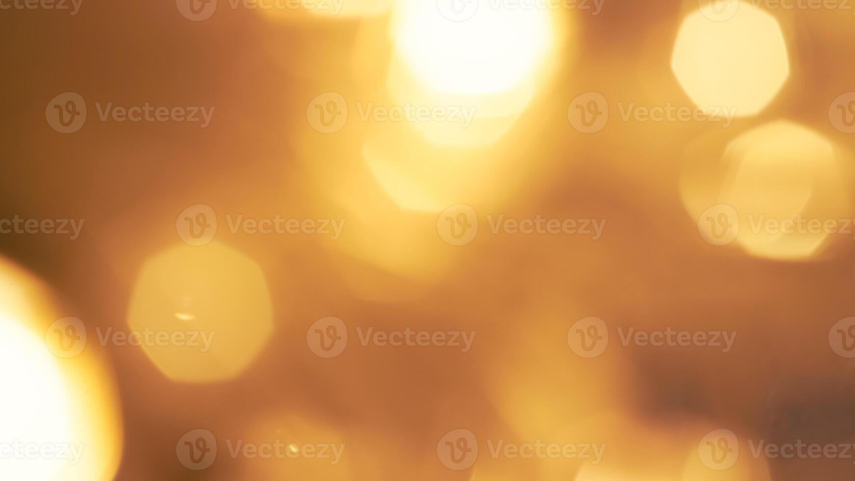 Shimmering golden bokeh lights in a vibrant holiday background with a radiant glow photo
