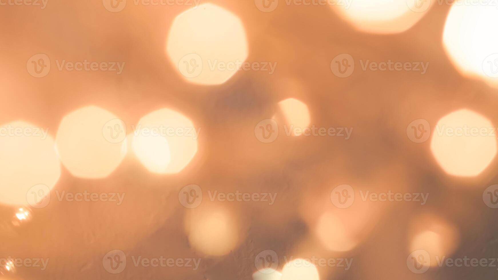 Bright golden bokeh lights create a festive and sparkling holiday ambiance photo