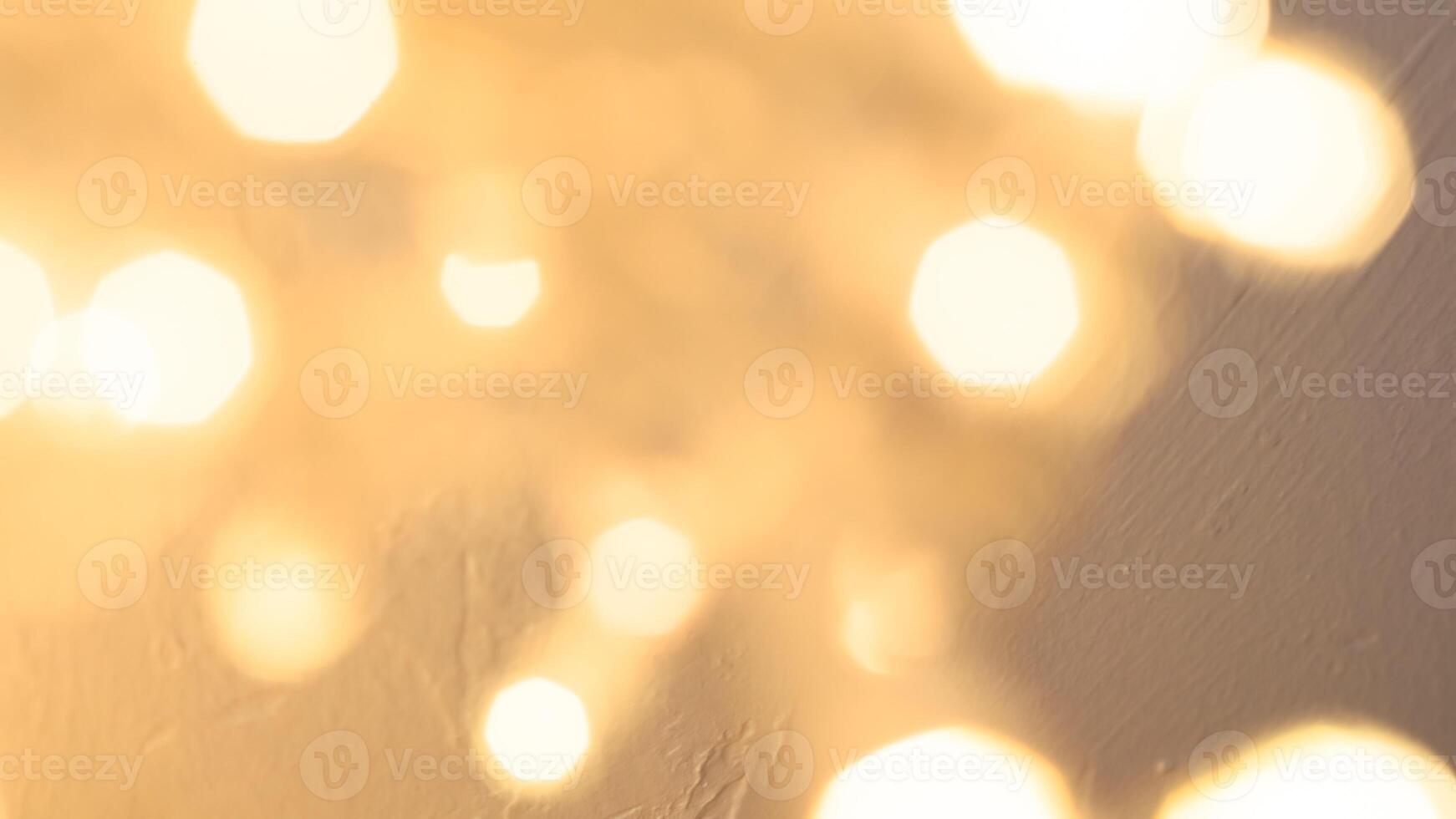 Bright golden bokeh lights create a festive and sparkling holiday ambiance photo