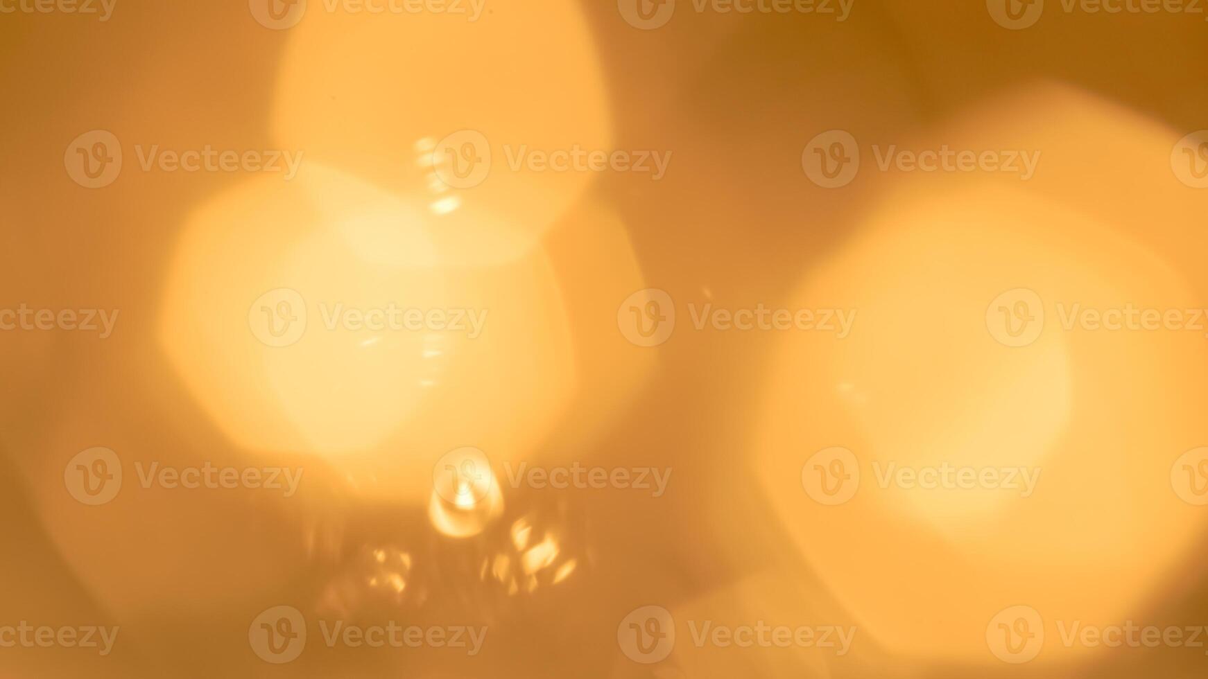 Golden bokeh festive lights with a soft, warm glow creating a cheerful atmosphere photo