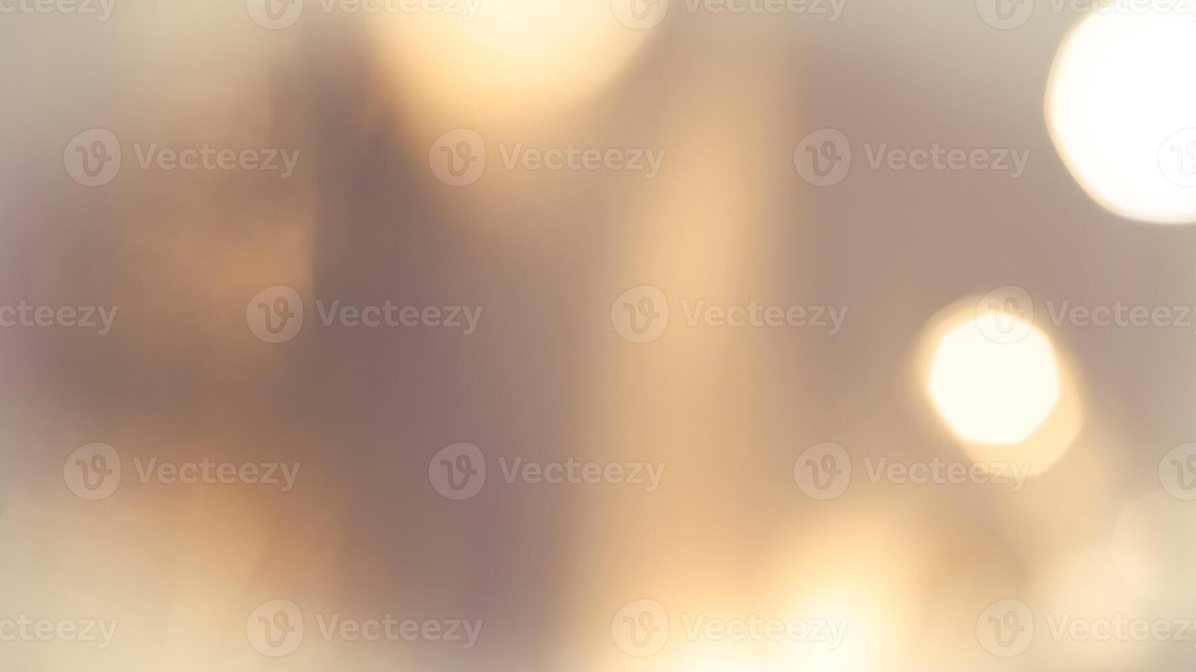 Warm glowing bokeh lights in a golden festive background for holiday celebrations photo