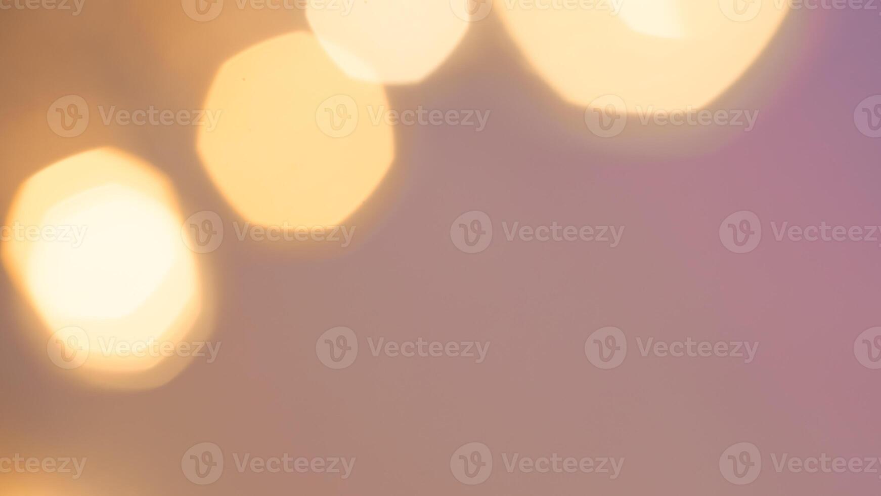 Shimmering golden bokeh lights in a vibrant holiday background with a radiant glow photo