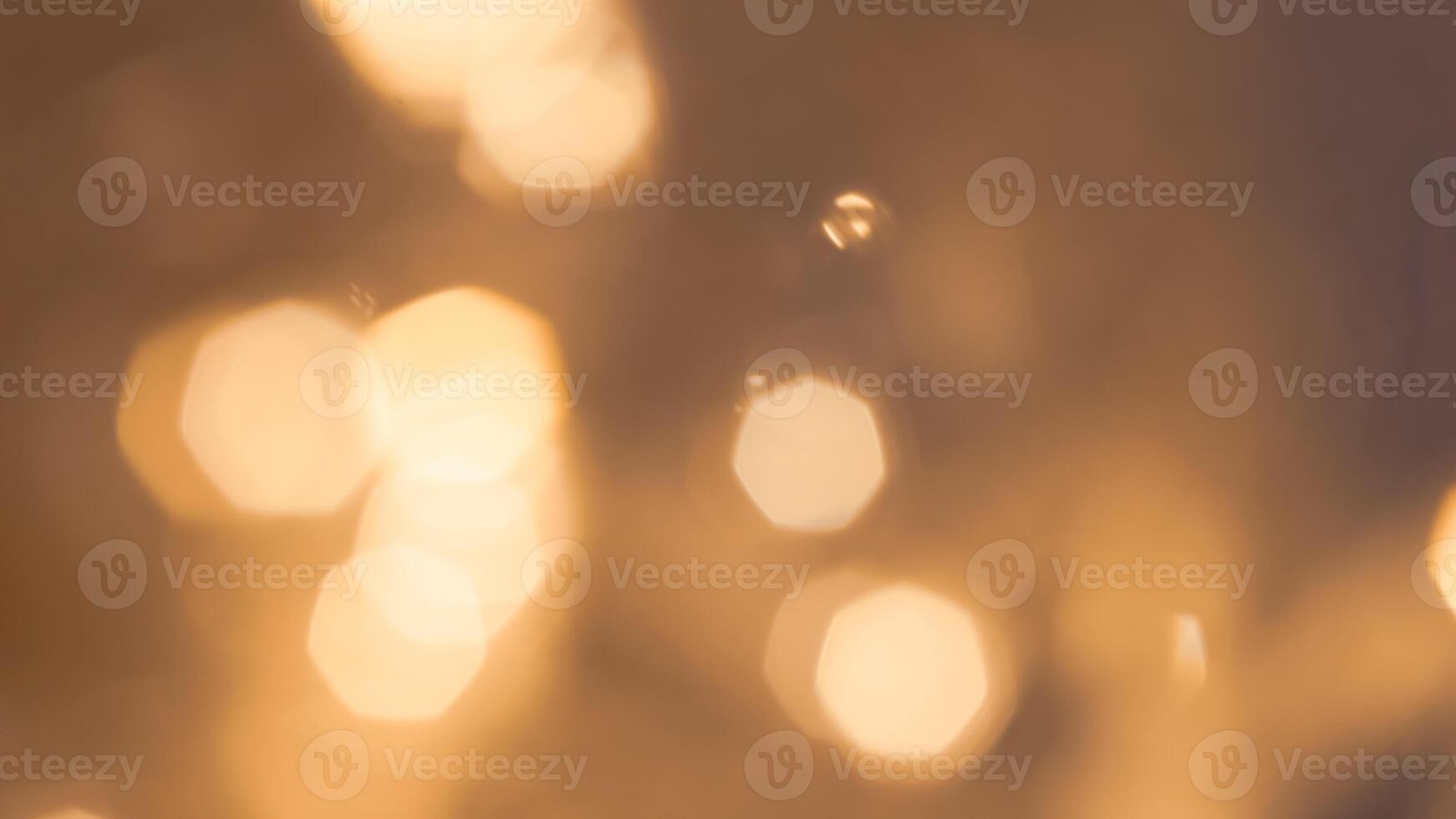 Shimmering golden bokeh lights in a vibrant holiday background with a radiant glow photo