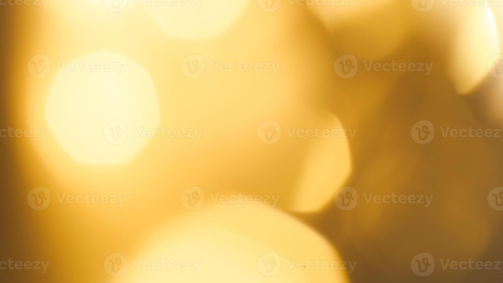 Golden bokeh festive background with soft, twinkling lights and a glowing effect photo