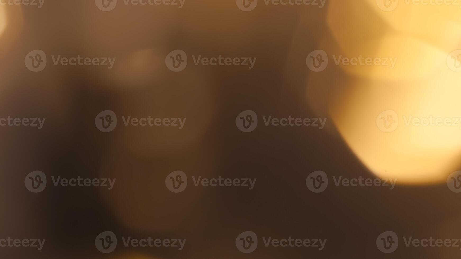 Golden bokeh festive background with soft, twinkling lights and a glowing effect photo