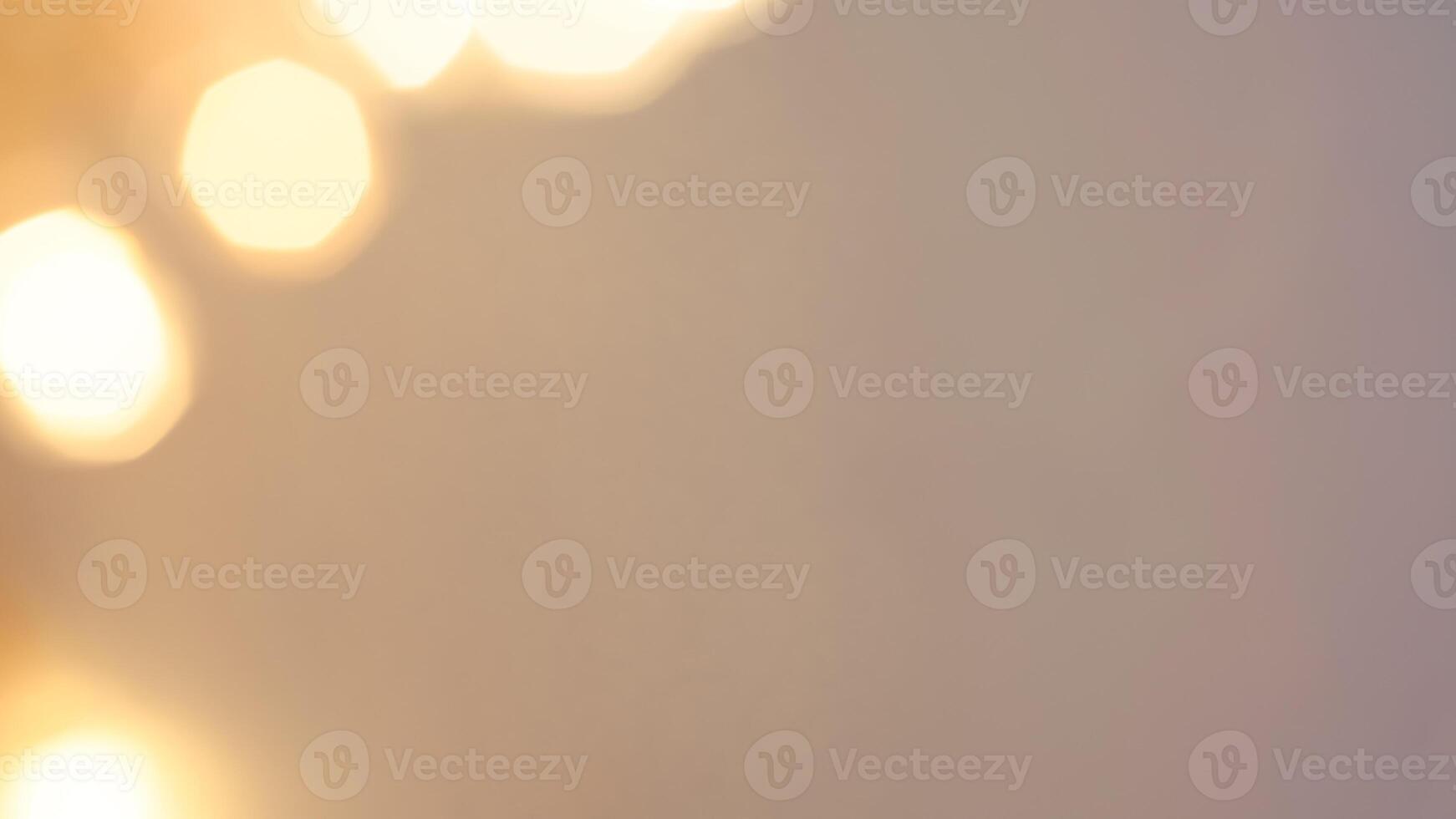 Golden bokeh festive lights with a soft, warm glow creating a cheerful atmosphere photo