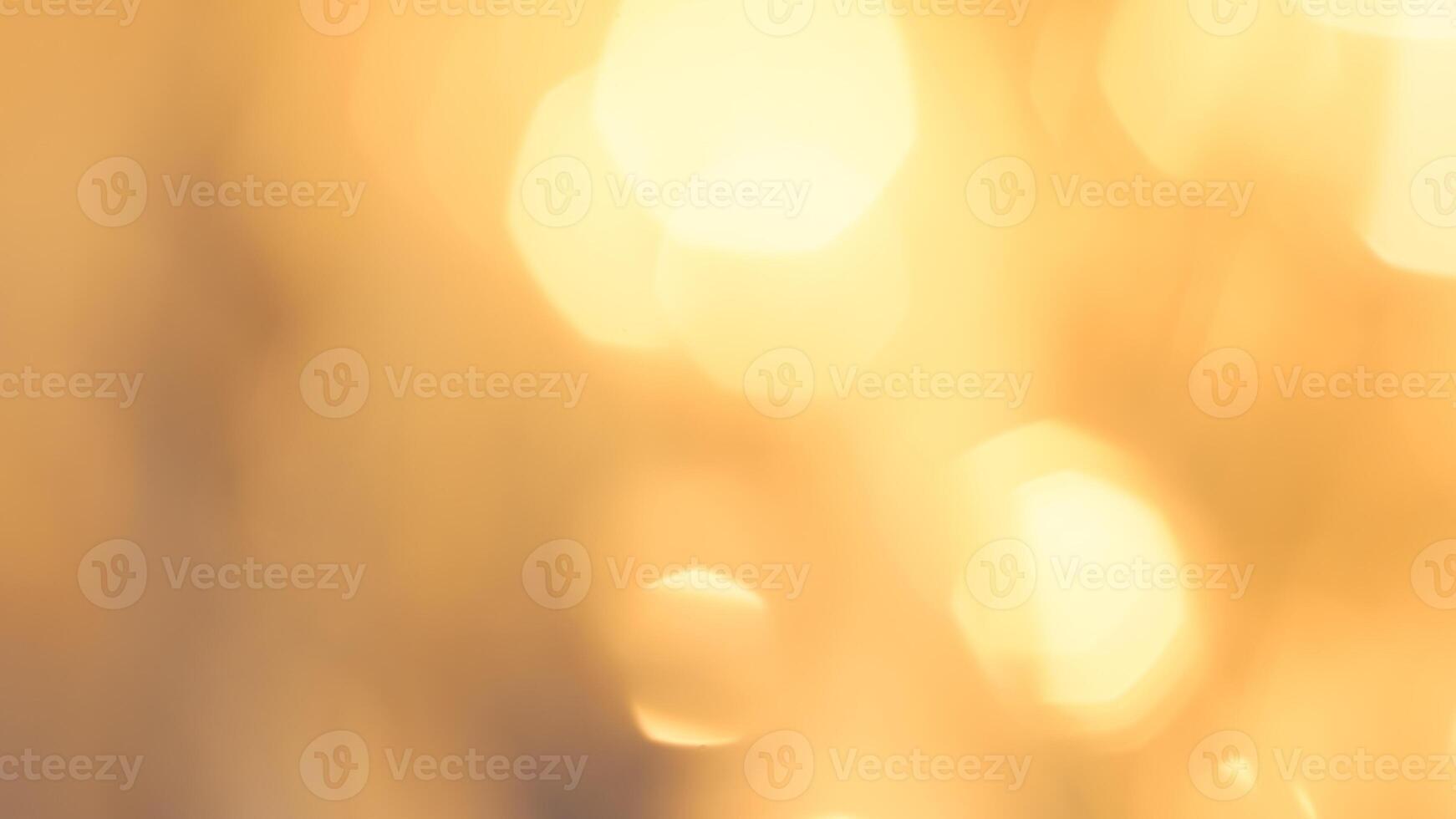 Golden bokeh festive lights with a soft, warm glow creating a cheerful atmosphere photo