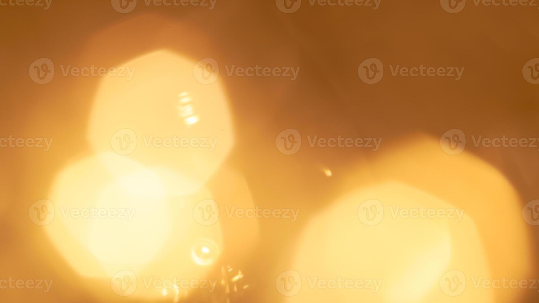 Golden bokeh festive lights with a soft, warm glow creating a cheerful atmosphere photo
