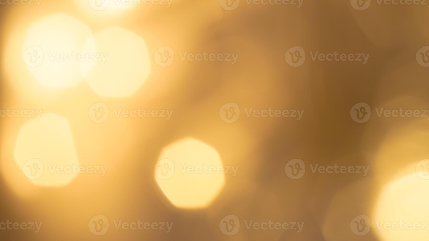 Shimmering golden bokeh lights in a vibrant holiday background with a radiant glow photo
