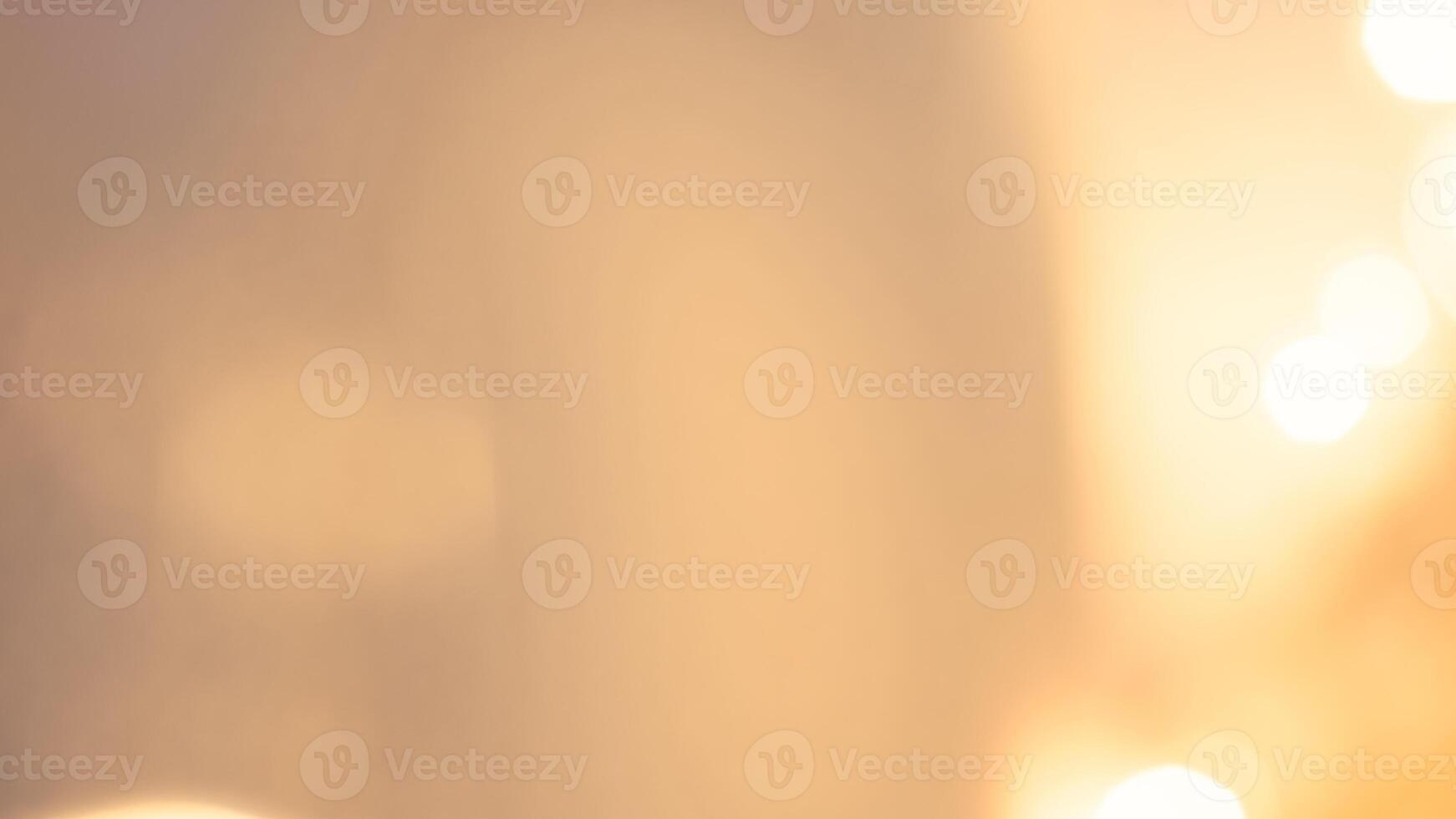 Warm glowing bokeh lights in a golden festive background for holiday celebrations photo