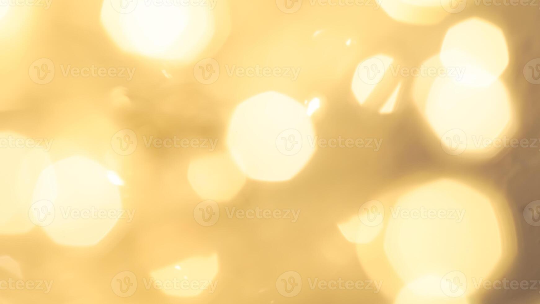 Shimmering golden bokeh lights in a vibrant holiday background with a radiant glow photo