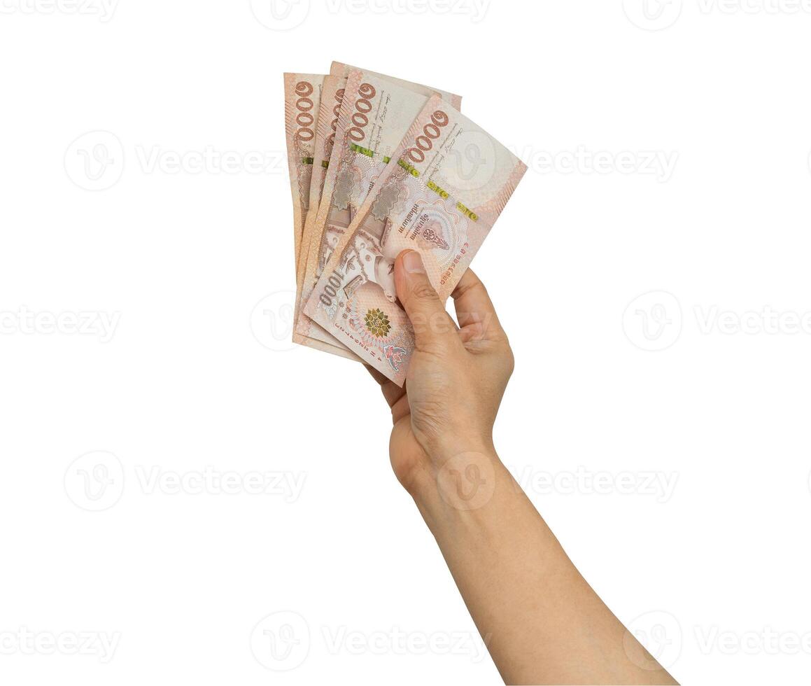 Asian woman holding Thai baht banknote money in hand isolated on white background with clipping path. photo