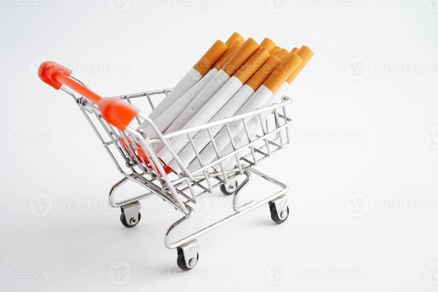 Cigarette in shopping cart, cost, trading, marketing and production, No smoking concept. photo