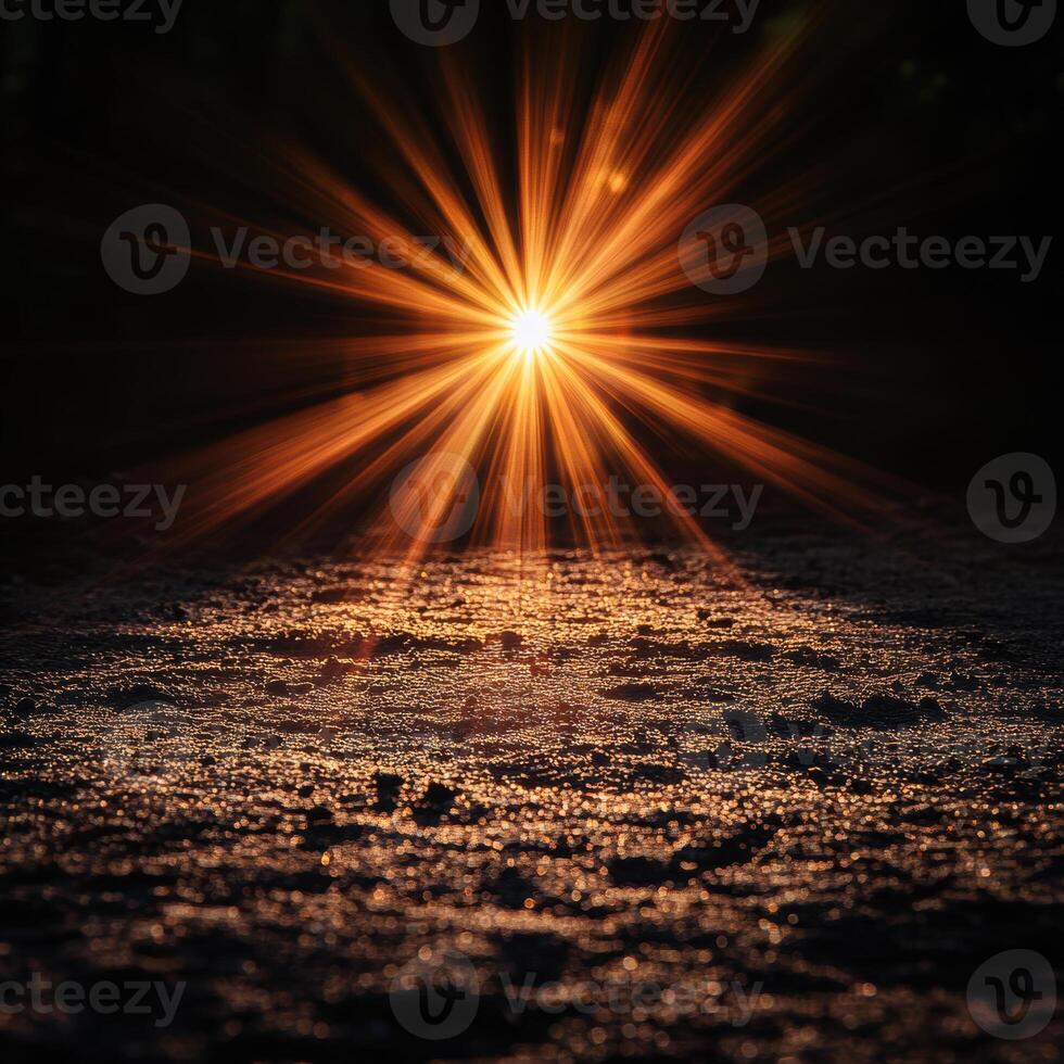 stunning sun flare illuminates ground, creating warm, golden glow against dark background. sparkling surface adds magical touch to serene atmosphere photo