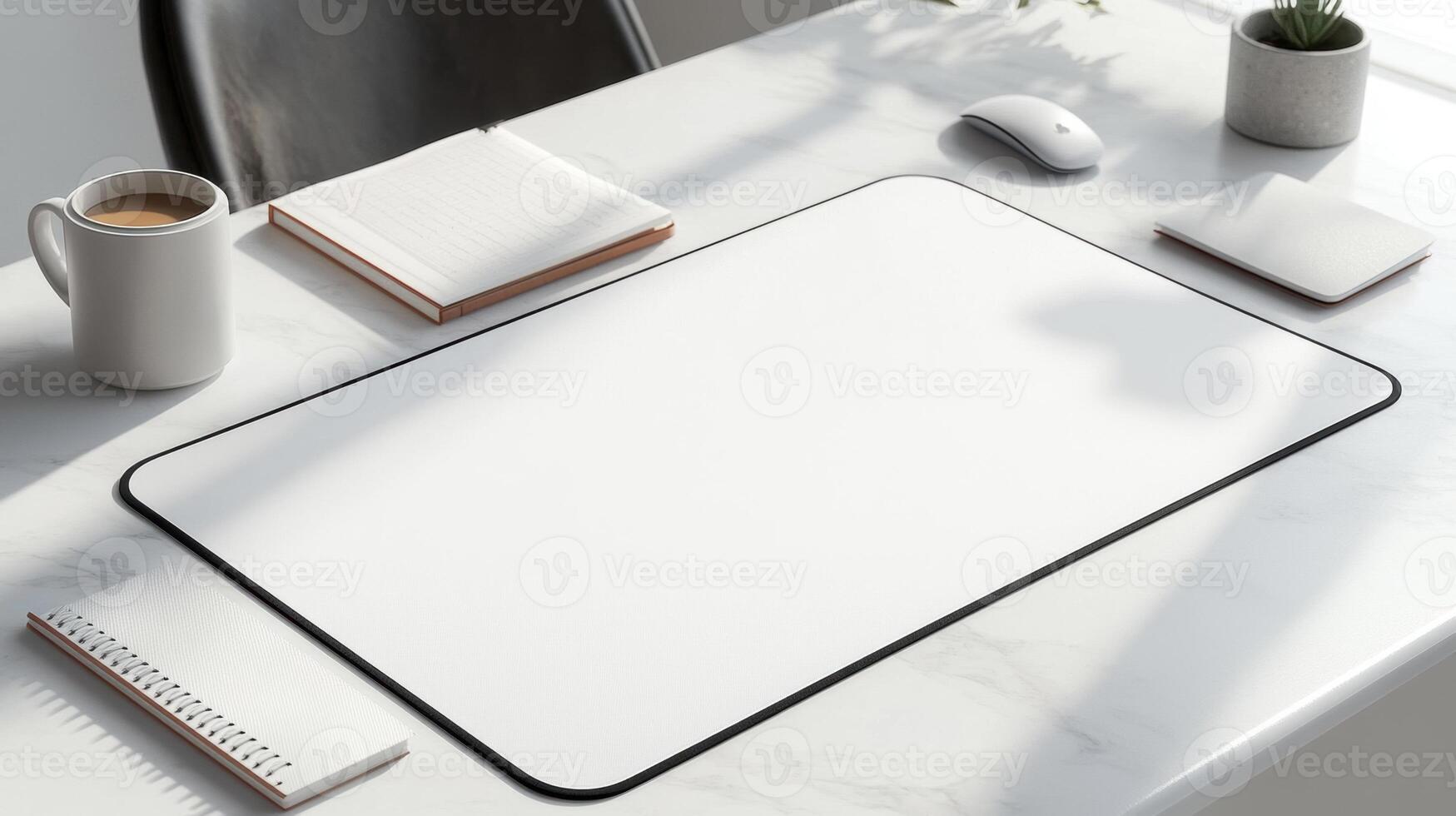 clean, modern workspace featuring white desk mat, coffee cup, notebook, and mouse. bright lighting creates serene atmosphere, perfect for productivity photo