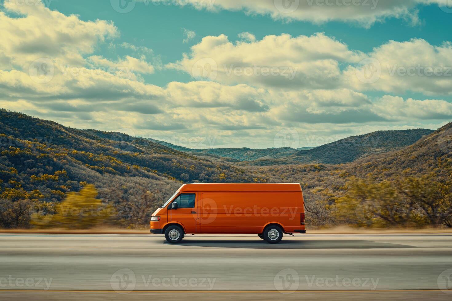 cinematic image of orange cargo van driving on highway surrounded by mountains and trees. scene captures sense of adventure and freedom photo