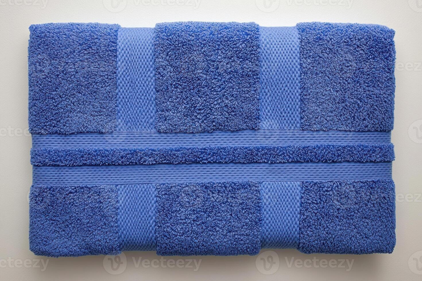 Soft oversized cotton bath towel in rich navy blue, perfect for adding comfort and style to your bathroom decor. Ideal for drying off after shower or bath photo