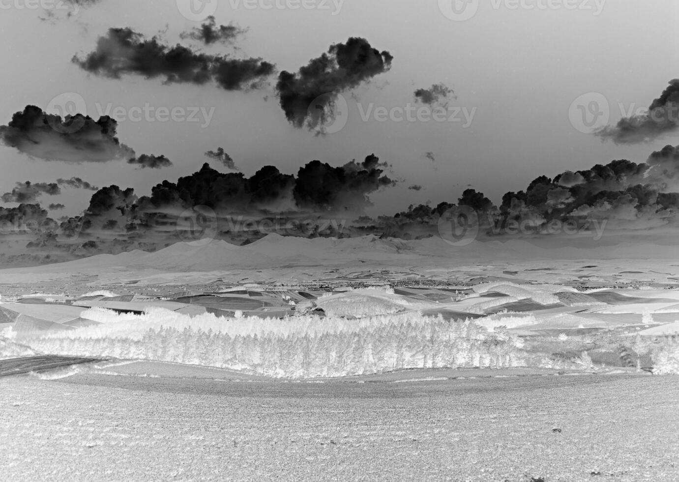 Serene Mountain Landscape Under a Cumulus Cloud Sky photo