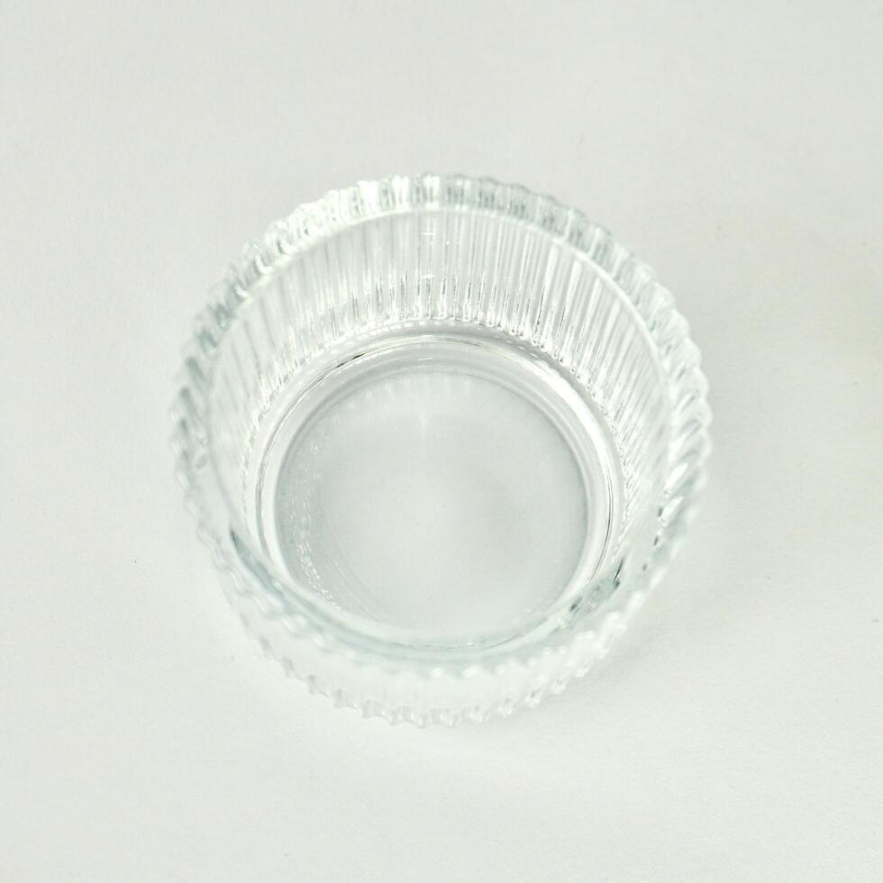 One empty clear transparent round bowl container object isolated on white background. photo