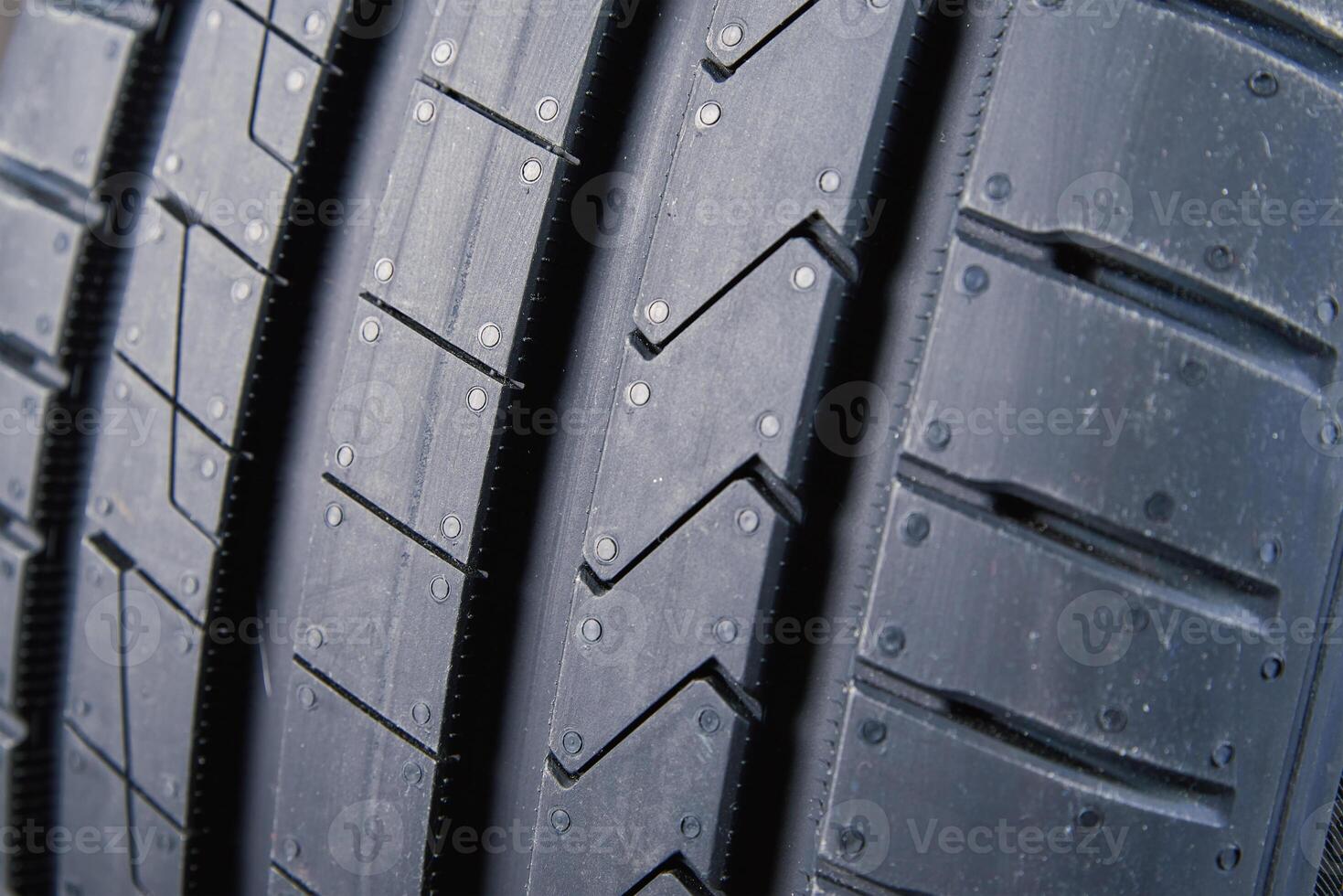 Detailed close up of tread pattern on new summer car tire photo