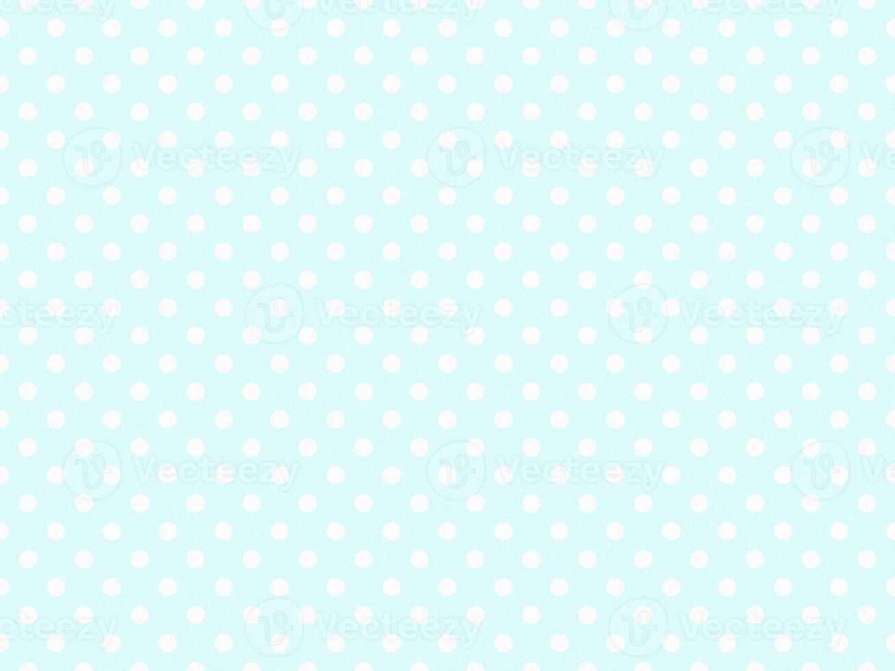 texturised white color polka dots over light cyan background photo