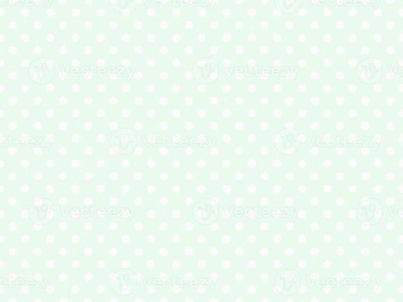 texturised white color polka dots over honeydew off white backgr photo