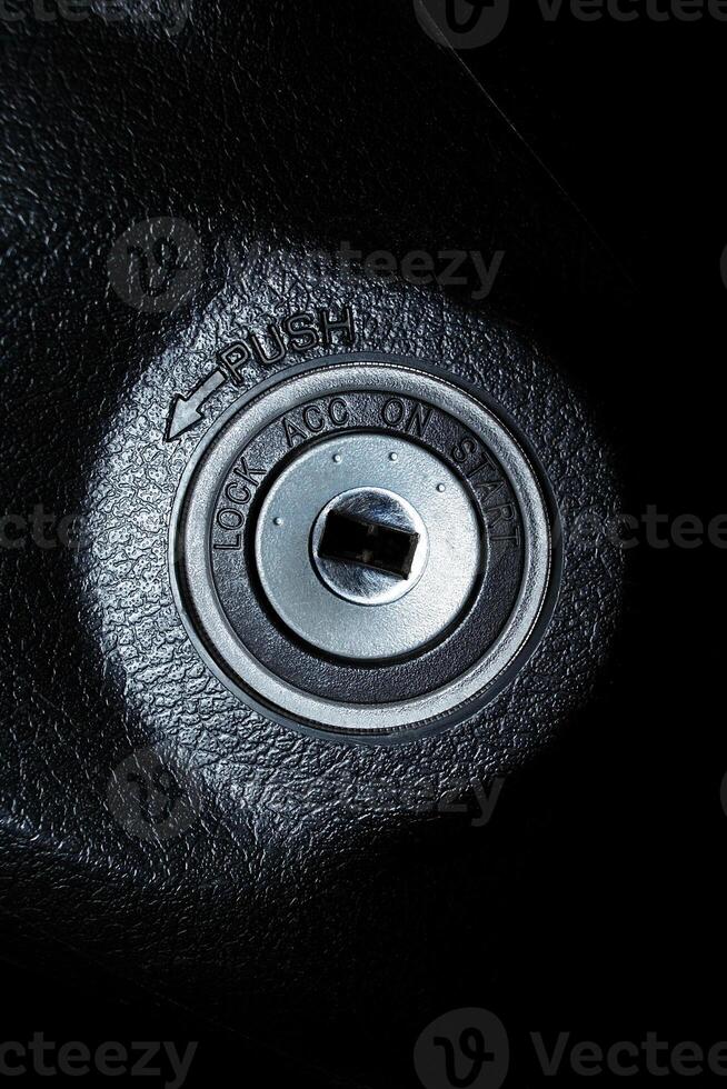 Car ignition keyhole with four step for starting the engine , Automotive part concept photo