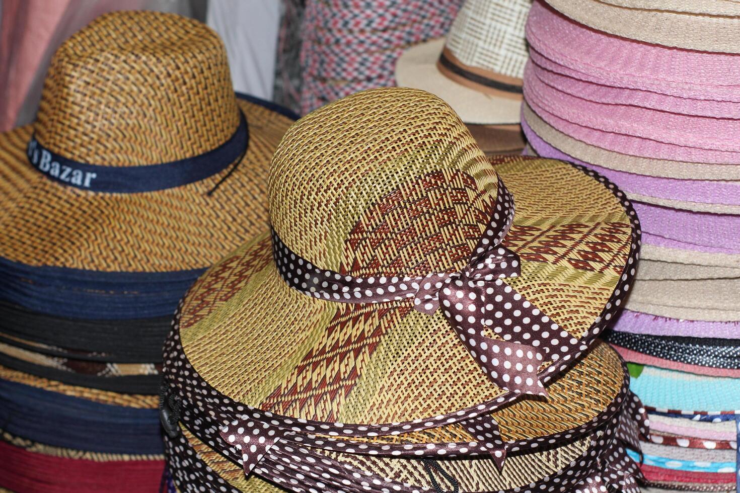 Straw hats for men sold in the shop. interior. Men's winter hats.Typical ecuadorian hats from the sierra in different colours photo