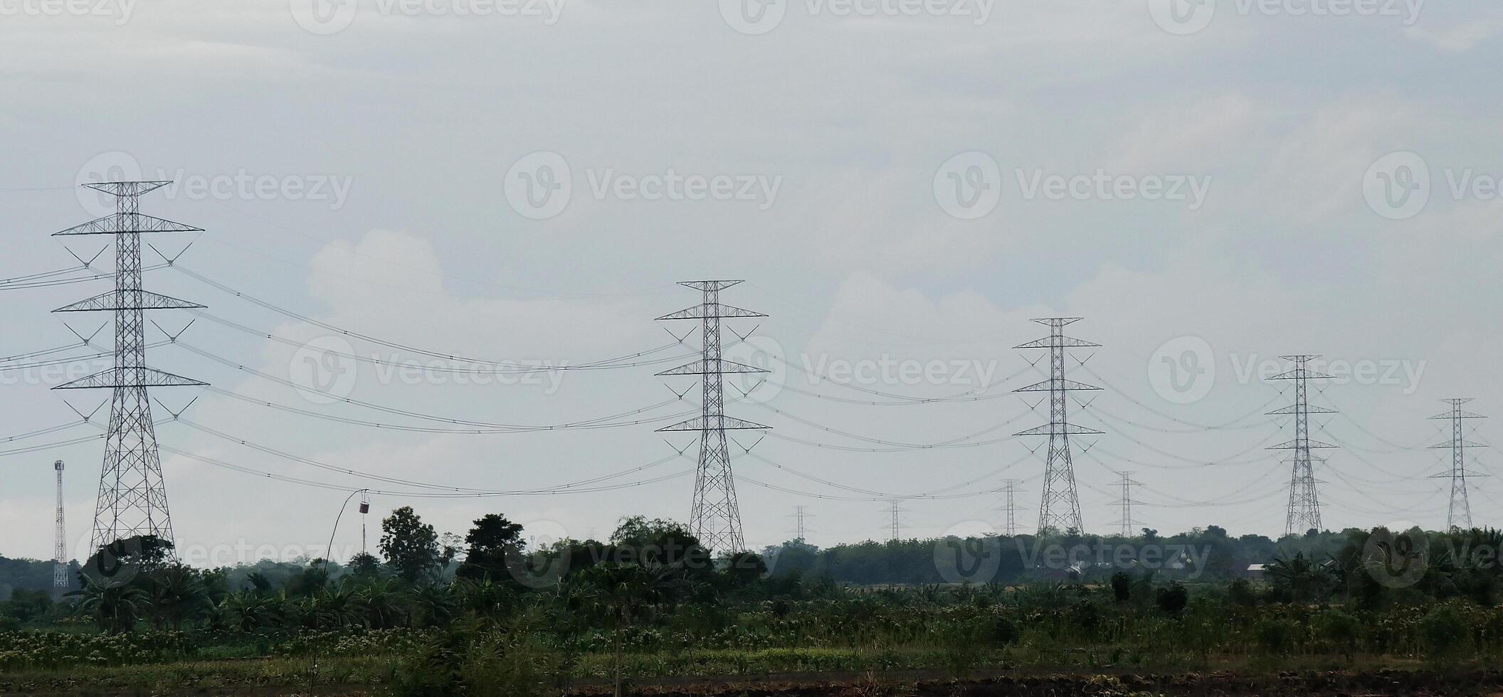 clouds and the silhouette of a power transmission tower. photo
