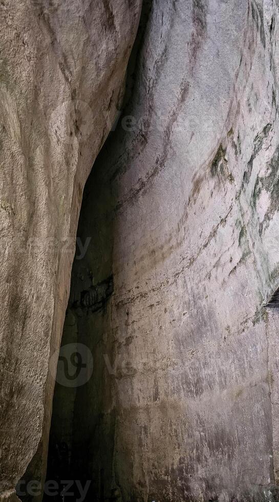 The Ear of Dionysius is an artificial cave located in the ancient stone quarry called latomia del Paradiso, under the Greek Theater of Syracuse. Dug into the limestone, it is about 23 m high photo
