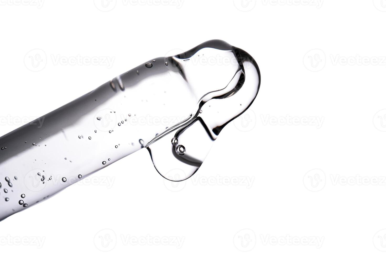 Dropper pipette with delicious serum with bubbles close-up. photo