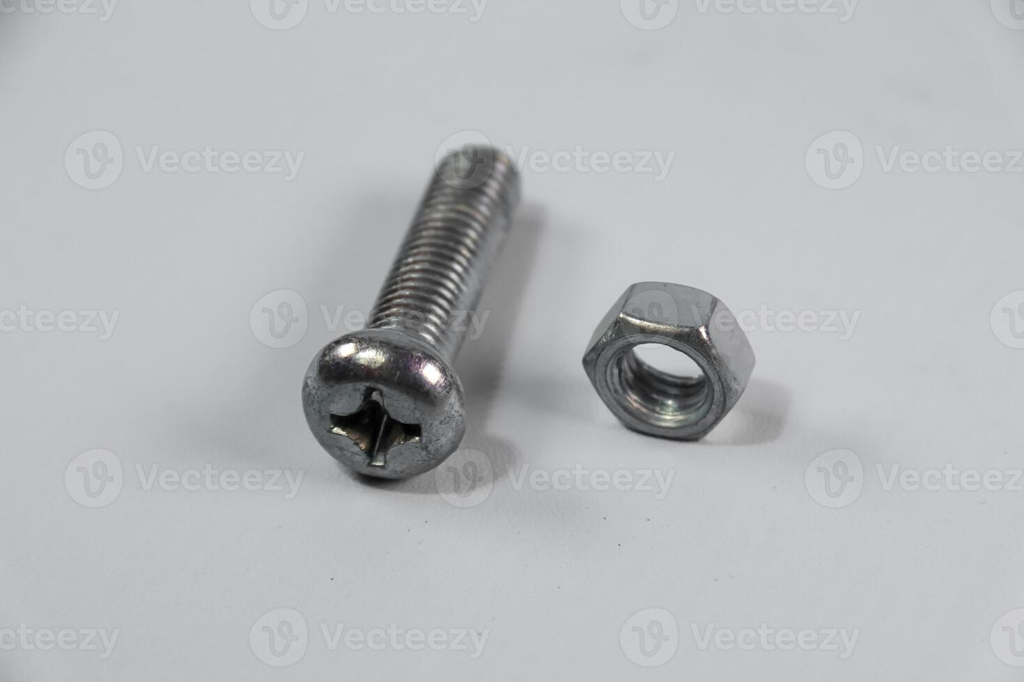 close up bolt and nut isolated on white background photo